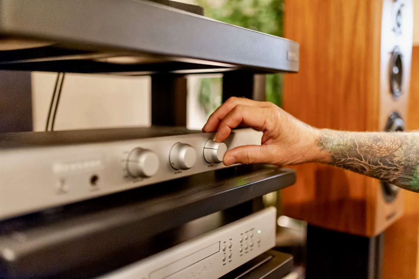 A person is adjusting the volume on an oven.