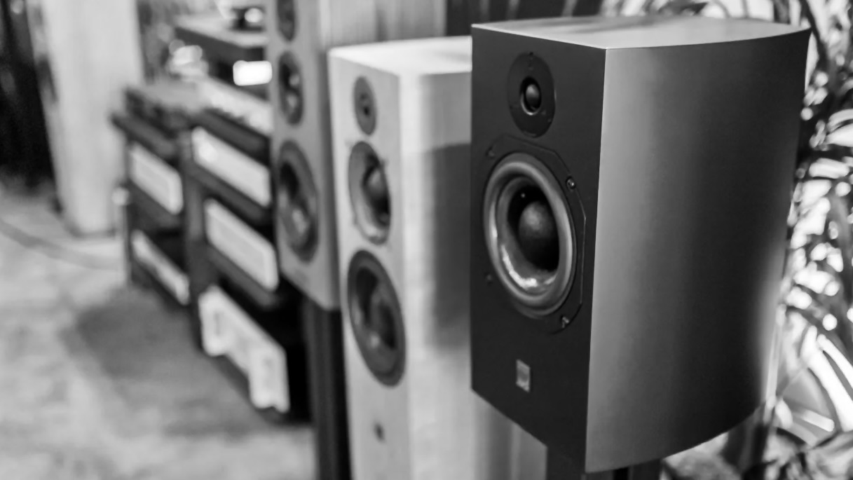 A row of speakers in black and white.